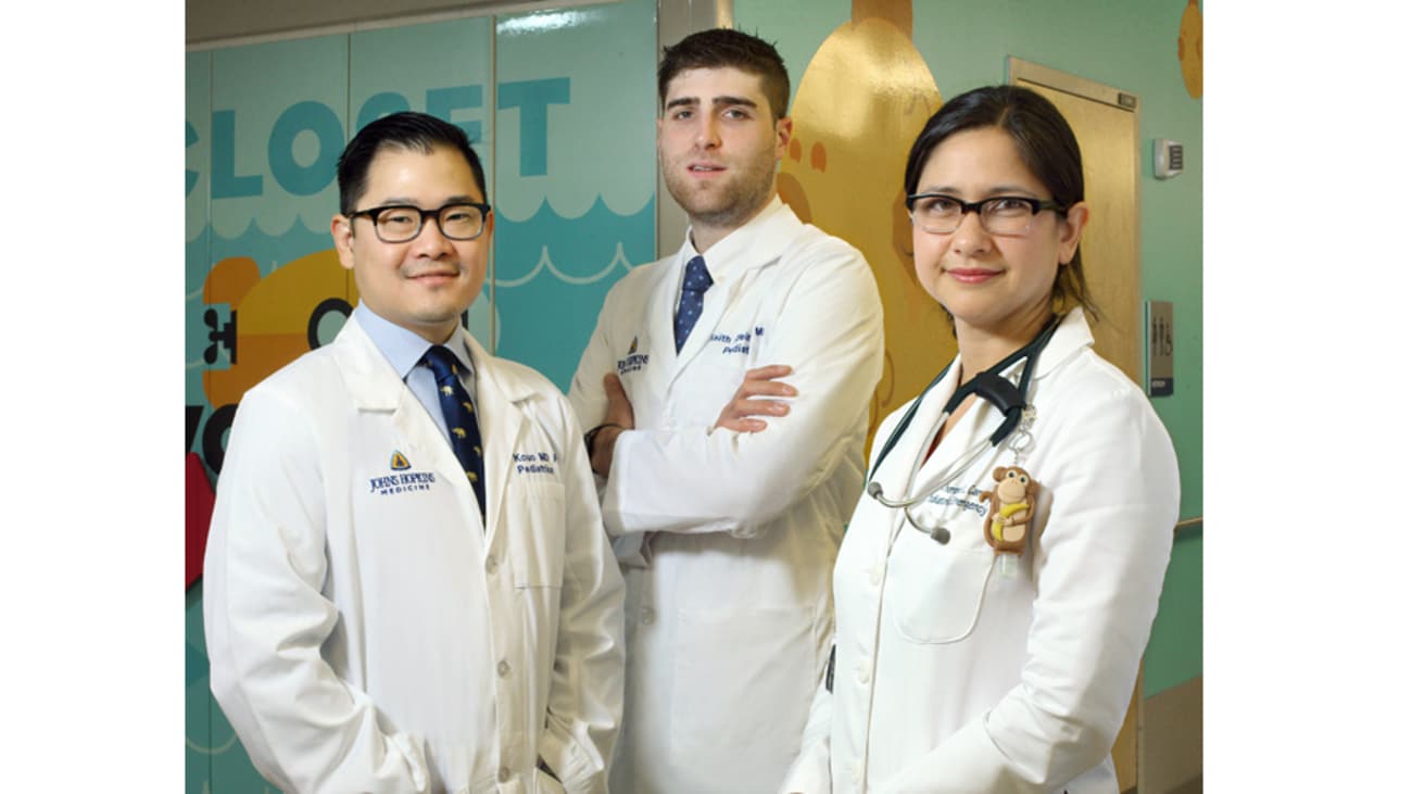 Quality improvement team members, from left to right, senior residents Ted Kouo and Keith Kleinman, and pediatric emergency medicine physician Therese Canares.