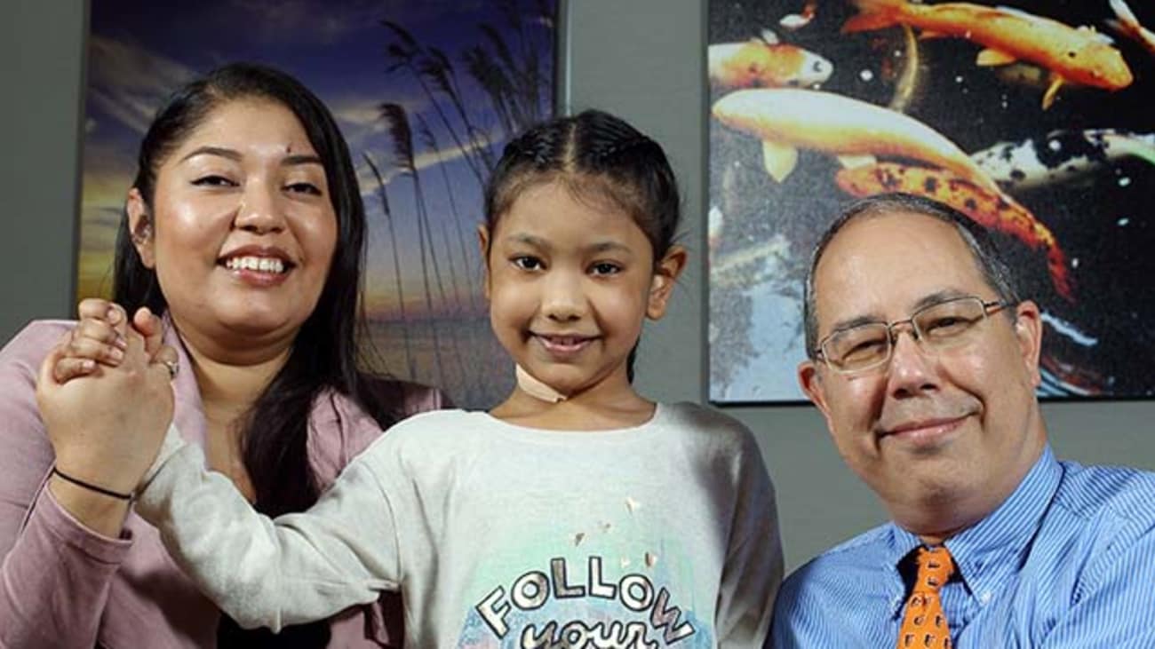 Stephanie Brown with her daughter, Maiyah, and pediatric cardiologist William Ravekes.