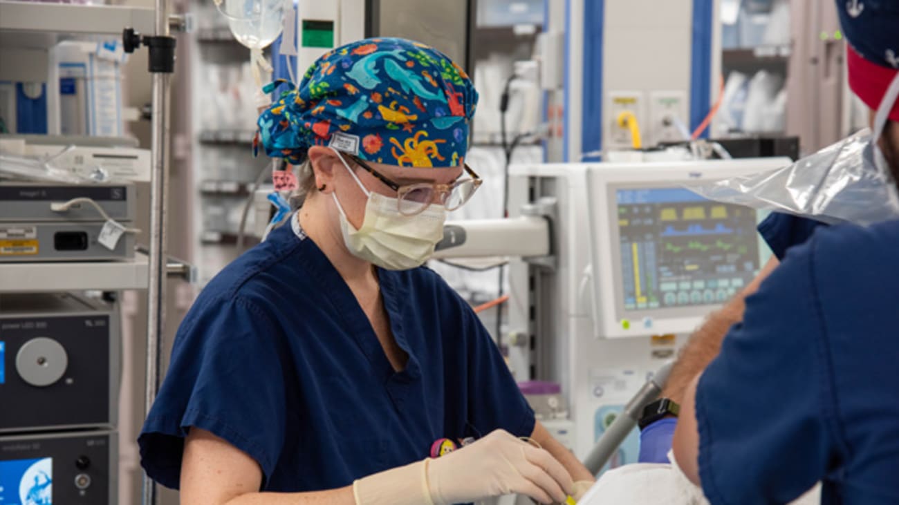 Natalie Barnett, M.D., performs an epidural on a young patient prior to surgery