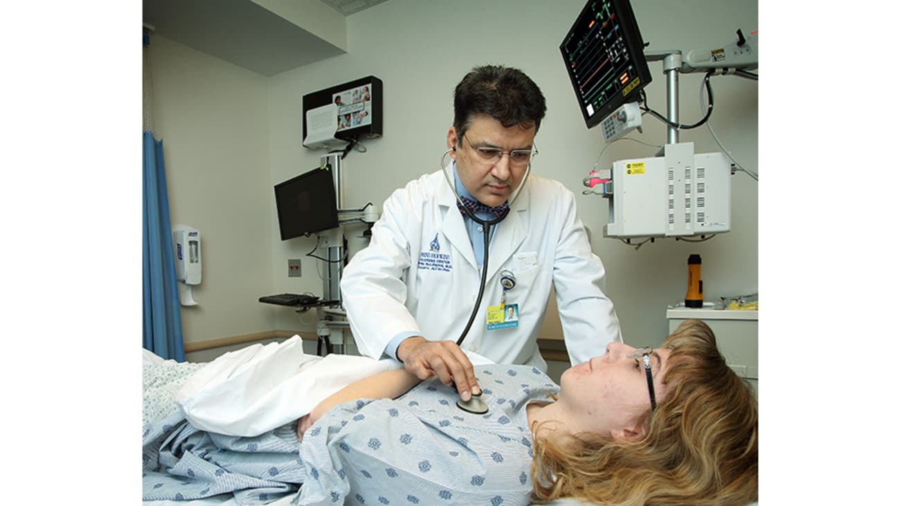 Pediatric anesthesiologist Irfan Suleman examines a patient.