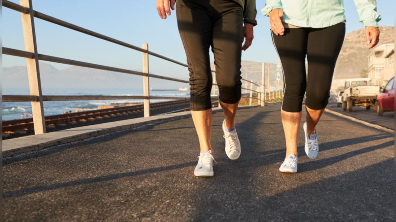 Two senior women walking together.