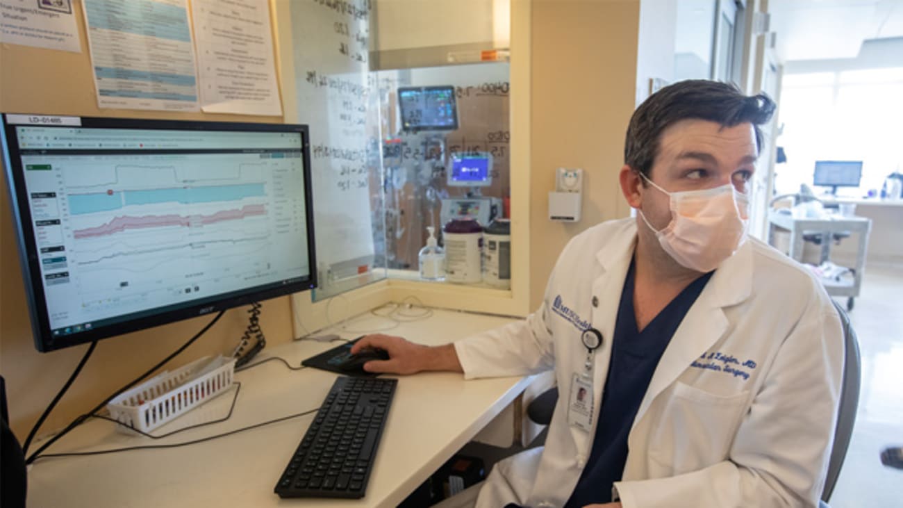 Sanford Zeigler, M.D., medical director of the cardiovascular intensive care unit, says a new program provides data that otherwise would be available only by sitting by the patient's bedside and charting every minute's change. Credit: Sarah Pack