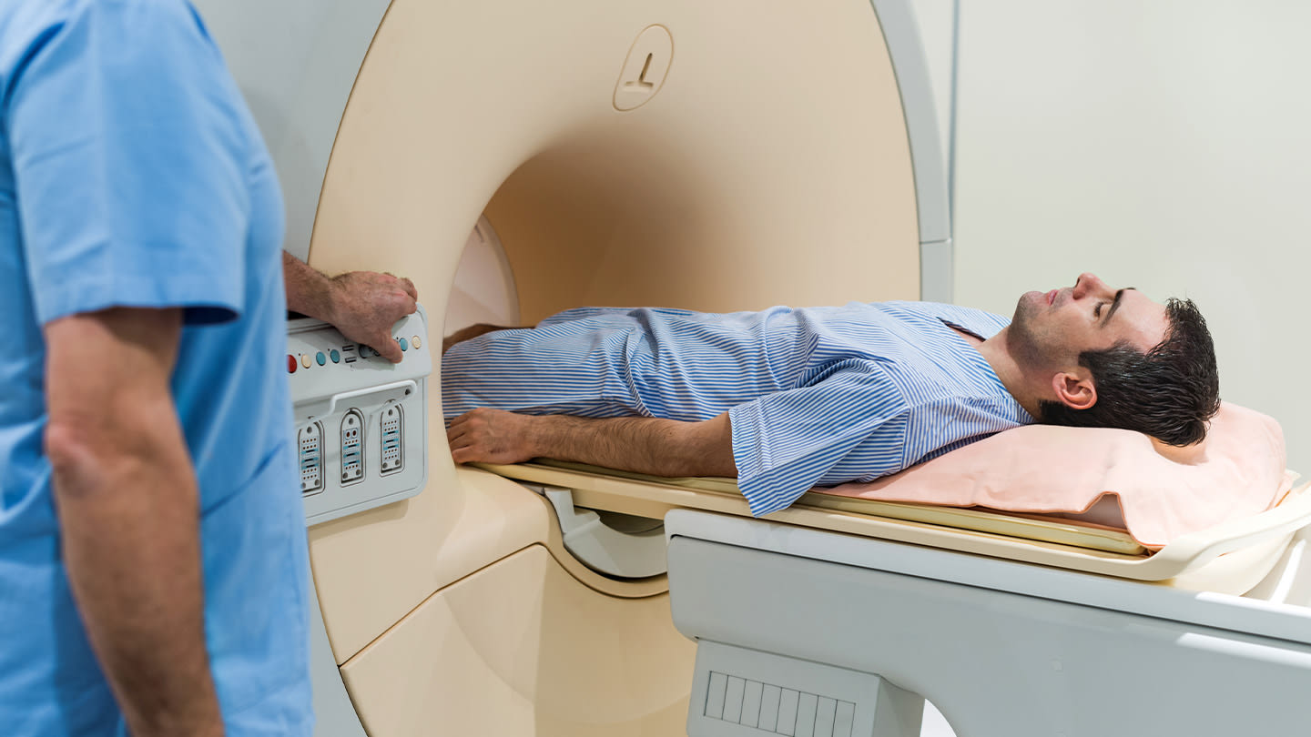 Patient positioned inside a medical imaging scanner.