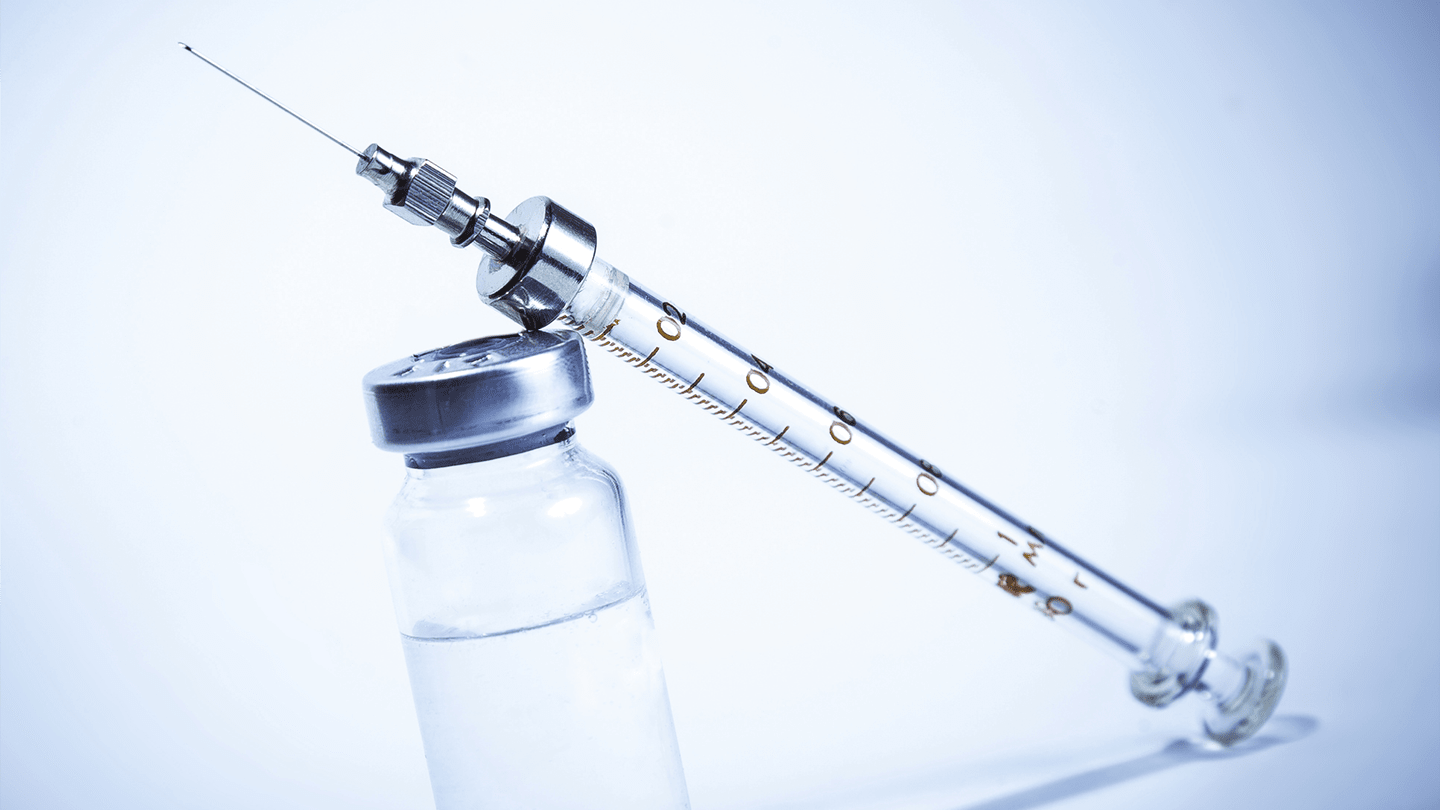 Syringe and medication vial.