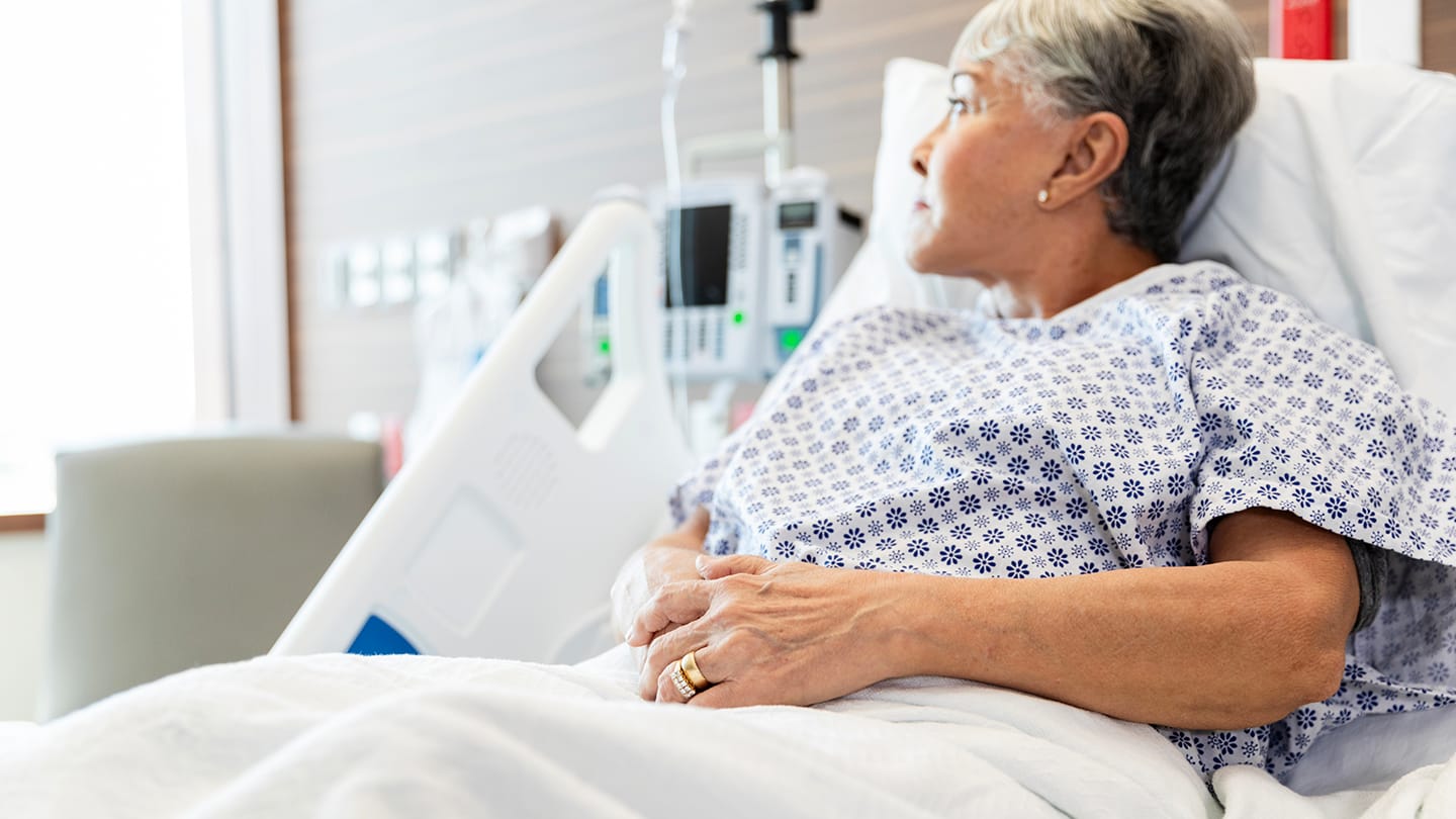 Patient resting in a hospital bed during treatment.
