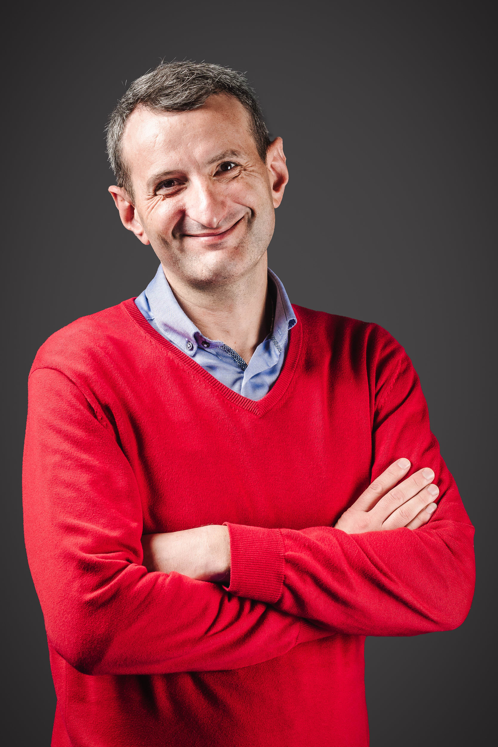 Philipp Schapotschnikow, PhD in a headshot with a red shirt