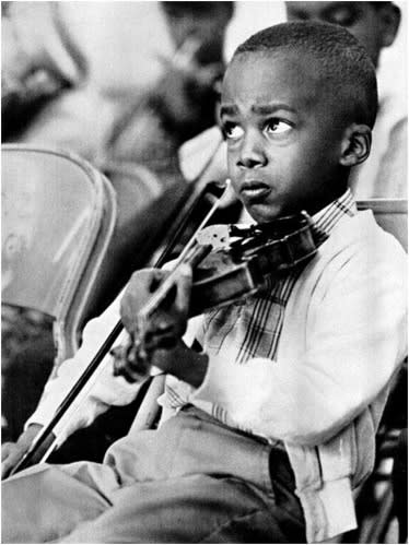 Dr. Cryer became a concert violinist at the age of six.