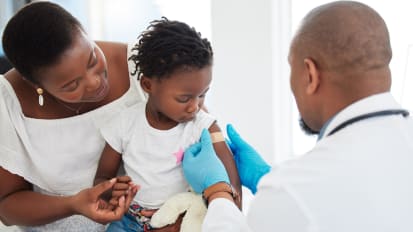 System-Level Approach to Improve First COVID-19 Vaccine Dose Uptake in a Primary Care Setting - The Value of Health Educators