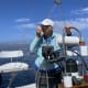 Jeannea Jordan captains her sailboat following her successful spine surgery. Photo courtesy of Jeannea Jordan.