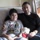 Adolfo Ledesma and his father sit on a hospital bed at UC Davis Children's Hospital.