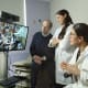 At Johns Hopkins Children’s Center, anesthesiologists Ivor Berkowitz, Joann Hunsberger and Sally Bitzer conduct a preoperative anesthesia evaluation of a young patient, with his mother and Richard Katz, chief medical officer at Mt. Washington Pediatric Hospital.