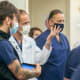 Arman Kilic, M.D., second from left, speaks during rounds in the cardiovascular intensive care unit at MUSC Health. Credit: Sarah Pack