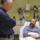 Jeffrey G. Ojemann, M.D., Division Chief of Neurosurgery at UW Medicine, left, talks with former tattoo artist Gary Williams before Williams underwent microsurgery to remove the part of his brain responsible for debilitating seizures. Williams agreed to donate the small bit of healthy tissue that had to be removed during the operation for scientific analysis.