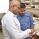 Study leader Srinivas Malladi, Ph.D., (left) worked with postdoctoral researcher Pravat Kumar Parida, Ph.D., to investigate the changing shape of mitochondria in breast cancer cells that migrate to the brain.