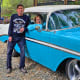 Recent surgery patient Martin Munson stands next to his wife, Sue, and his classic Chevrolet Bel Air.