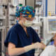 Natalie Barnett, M.D., performs an epidural on a young patient prior to surgery