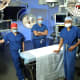 from left to right: Pediatric critical care physician Jamie McElrath Schwartz, pediatric cardiac surgeon Bret Mettler and Shelby Kutty, a pediatric cardiologist, jointly direct the Blalock-Taussig-Thomas Pediatric and Congenital Heart Center