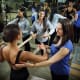 Physical therapists Andrea Lasner, top, and Amanda Greene, right, work with dancer Cyndal Gilmore.