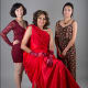 Barbara Ross wears a red dress created by UC Davis students Betty Chen (left) and Heaji Richards, whose design was inspired by Ross' elegance and her courage in overcoming heart disease.