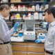 Pengei Li, Ph.D. (left) and Hongkuan Fan, Ph.D. (right) working in their research lab at MUSC. Credit: Sarah Pack