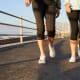 Two senior women walking together.