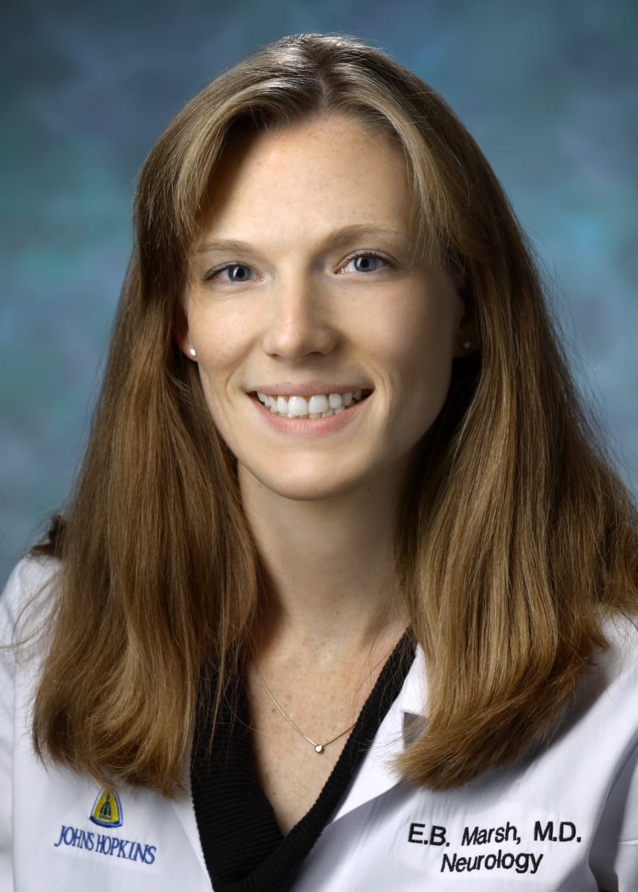 Elisabeth Breese Marsh, in a formal portrait, wearing a white lab coat and a black blouse