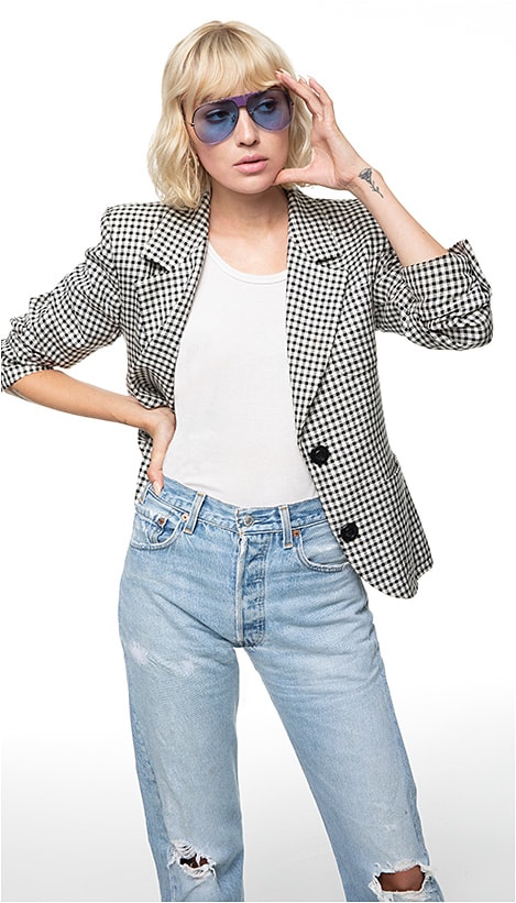 In Living Color
THE TREND: Vivid Color
SHOWN: Police SPL740 from De Rigo REM in ultra-violet with blue-purple mirror lenses features a glitter-injected rubber bridge and temple tips.
CLOTHING: Model’s  own vintage Yves Saint Laurent jacket and  repurposed Levi’s.