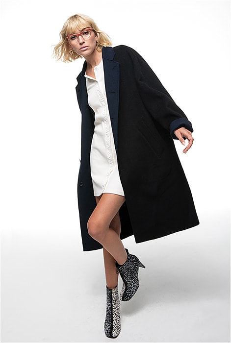 On the Edge
THE TREND: Funked-Up American Classics
SHOWN: rag &amp; bone RNB3009 from Safilo is an acetate-and-metal combo style in peach combining classic, edgy, and retro musings.
CLOTHING: Dress, coat, and boots all kindly supplied by rag &amp; bone.