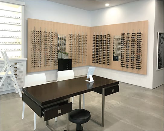 Custom-made wood frame displays line the walls.