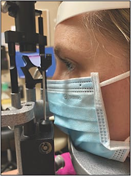 Figure 4. BYD single-use surgical mask 2311X positioned at the slit lamp.
