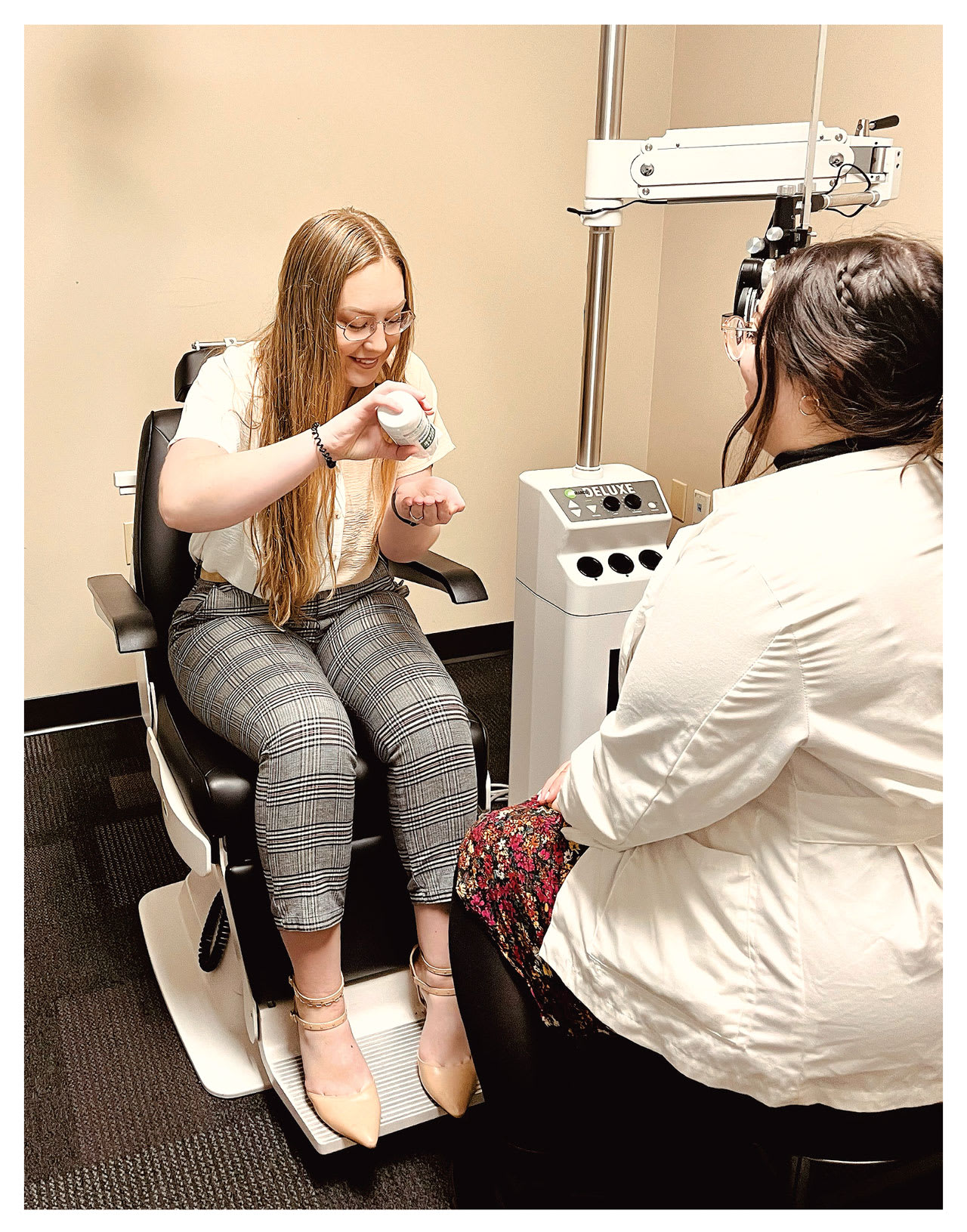 Two members of Dr. Lievens’ clinic demonstrate how to properly rub contact lenses to clean them.