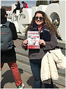 Editor Shannon Simcox with Optometric Management while in front of the Amsterdam sign for the social media series "Traveling OM!"
