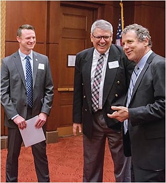 Drs. Shane Foster, at left, and Michael Earley, center, speak with U.S. Senator Sherrod Brown, representing Ohio, during the American Optometric Association AOA on Capital Hill meeting.Photo courtesy of Dr. Shane Foster.