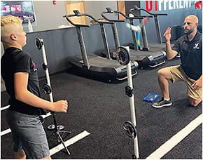 F4 racecar driver working on reaction time, visual processing and eye-hand coordination. Photos courtesy of Dr. Joe LaPlaca.