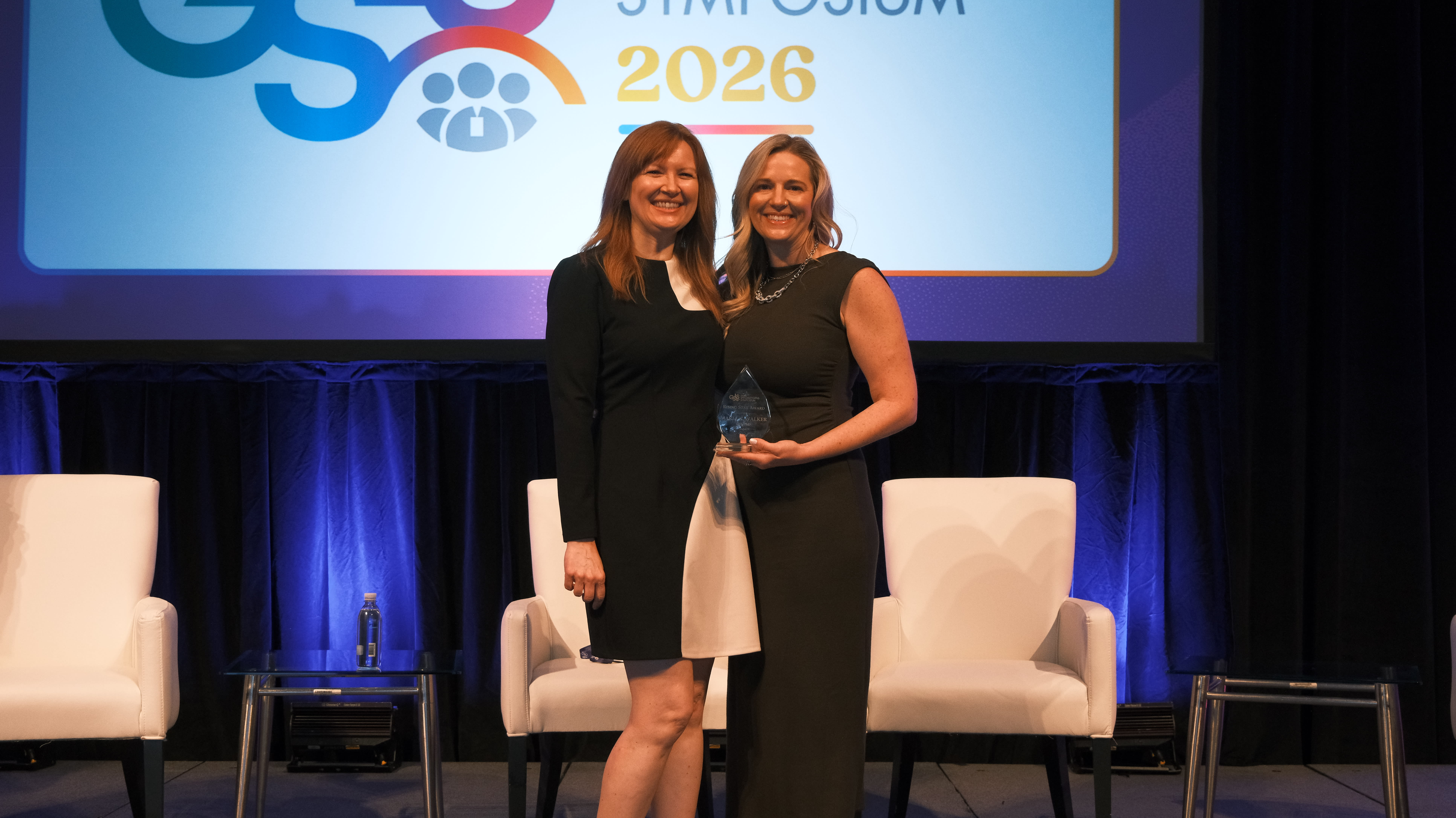GSLS vice chair Jennifer Fogt, OD, MS, presents Maria K. Walker, OD, PhD, with the 2026 Rising Star Award.