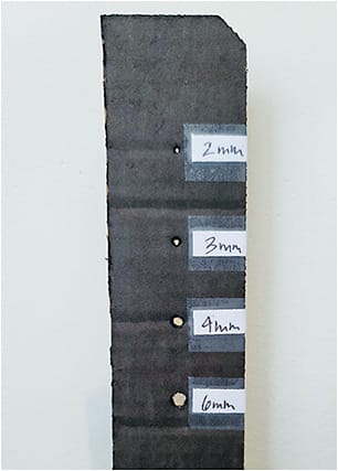 Figure 2. A pinhole gauge created out of cardboard to assess a pupil size that will best alleviate the dysphotopsia experienced by your patient.