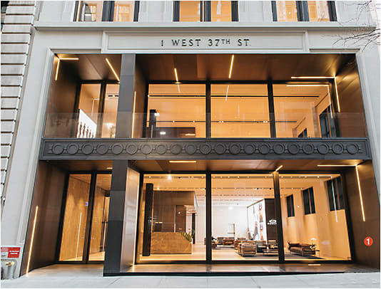 1 Luxottica restored the façade of the historic building, including the limestone moldings, crown pieces, and metal panels.