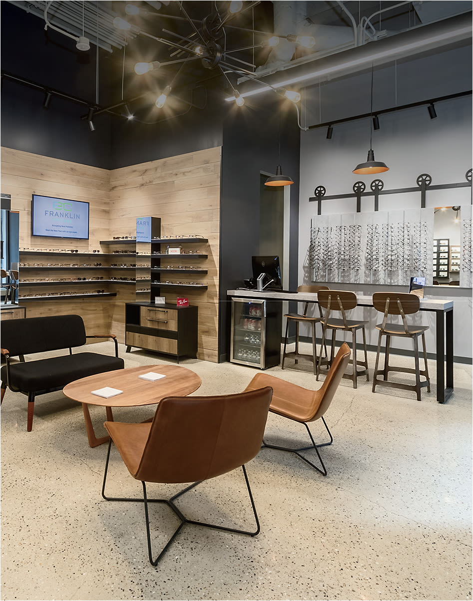 The lounge and eyewear bar at Franklin Eye Care in Chicago. Photo Courtesy One Interior.