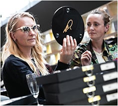 A SILMO attendee eyes Cazal sunglasses.