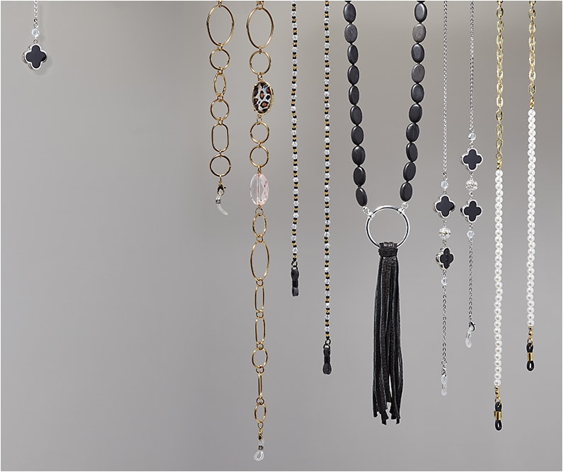 Urban Outfitters (left to right): Hilco’s Trista dangler offers a modern hint of animal print. Croakies’ chain from the World Cords collection features Czech glass beads and UV-resistant spec ends (SKU #WC1CZ15HT). La LOOP model 211P pairs onyx beads (storied to have protective qualities that repel negativity), a silverplated loop, and a black leather tassel. Ron’s Optical mixes black and crystal-colored shapes and adds lobster claw clasps with its Ava chain. Corinne McCormack blends elegant and edgy with faux pearls and 6mm chain (SKU #10401084).