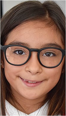 A happy beneficiary of Kids Vision for Life.