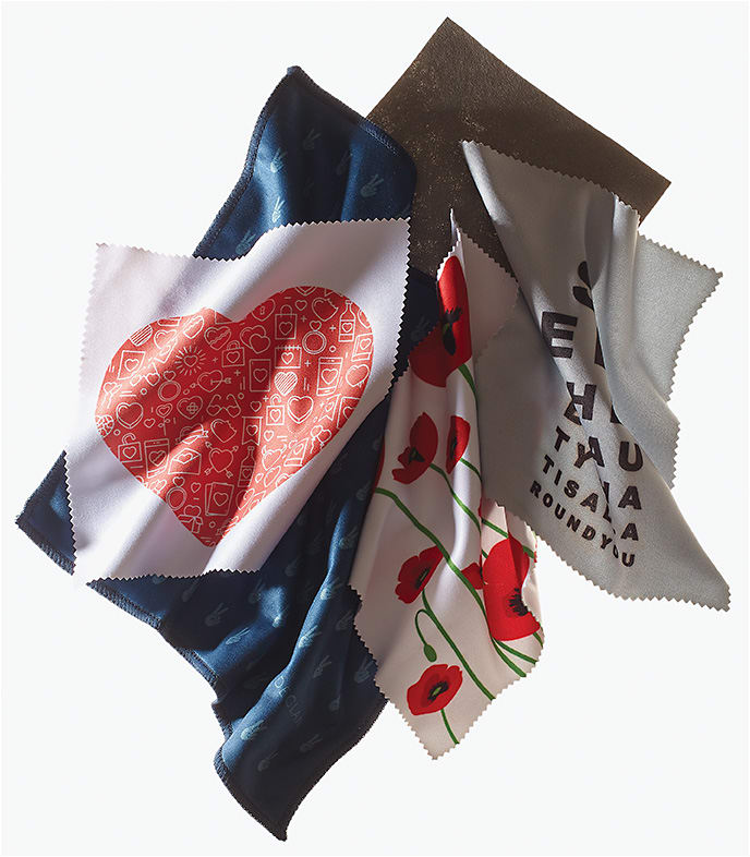 CLEAN SWEEP 
(from left to right):
The premium custom cloth from Clearlens in special-edition Valentine’s Lovely Hearts can be fully personalized with practice information. Declan’s Thomas cloth offers peace of mind with a stylish design to serve as a pocket square and eyewear/touch-screen cleaner. The Spring Poppies microfiber cloth from Hilco Vision delivers playful pops of color. Eco-friendly Jude’s Miracle Cloth boasts a patented manufacturing method for its wedged cross sections of fiber to lift dirt and oil. An optical catchphrase cloth from CalOptix inspires with an eye chart message, “See the beauty that is all around you.”
