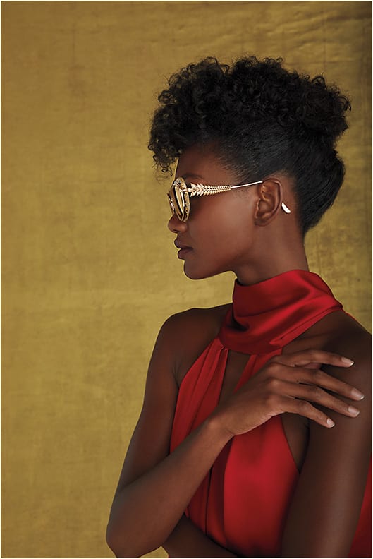 COLLAB CACHET 
Chopard SCHD39S (in 300G) Cannes Special Edition Sunglasses from De Rigo REM is a ’50s cat-eye with gold foil leaf acetate, 24kt gold-plated mirror lenses, and a jeweled metal temple with zircon crystals. This special style draws inspiration from the iconic Palme d’Or “Golden Palm,” the highest prize awarded at the film festival. Each frame also comes with a luxurious hat box and clutch case in gold satin.