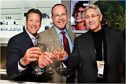 From left: Essilor of America's Howard Purcell, Rick Gadd, and Bob Colucci toast Crizal's 25th anniversary