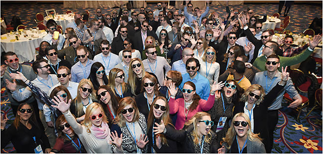 Members of the brand sales group kick off the meeting with smiles (and popular Snapchat Spectacles)