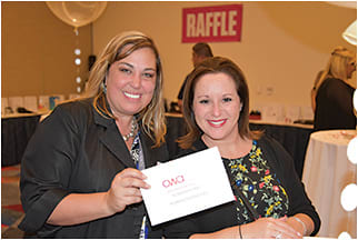Dawn Alcorn of the Essilor Vision Foundation, left, and Cherie Gifford of Essilor of America at the OWA networking and raffle event