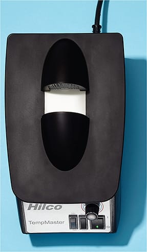 1 “The fitting of acetate frames must be done exclusively with the FRAME WARMER and hands, from controlling the width of the frame to the bending of the temple tips.”
Pictured: Hilco Vision’s TempMaster Deluxe Frame Warmer