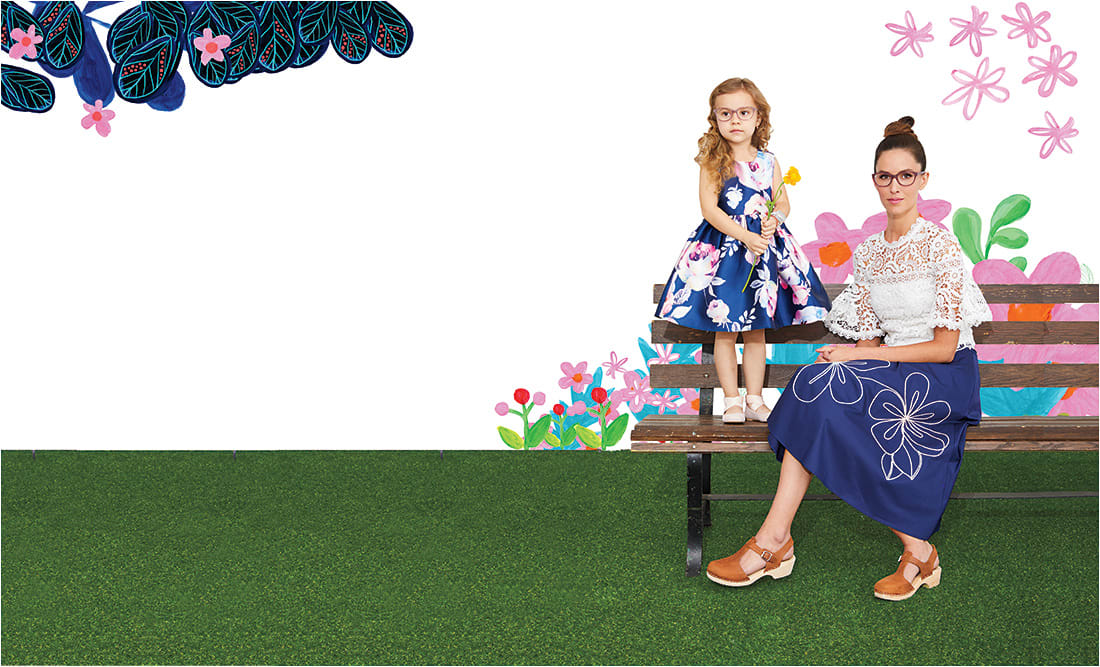 All in the Family Mommy + Me style is a notable trend du jour in kids’ eyewear, and these Converse styles glimmer on in a soft, modern hue emboldening a cat-eye shape with embedded glitter. Here, Converse Kids K404 (on Alexandra) and Converse Q404 (on Hannah), both from De Rigo REM.