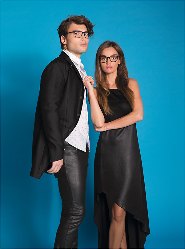 ELEGANT + EDGY
On Joe: Converse style Q311 from De Rigo REM is an urban-active acetate frame with graphite finish stainless steel temples. On Allie: CH Carolina Herrera model VHE717 from De Rigo REM is an elegant upswept double layer handcrafted acetate style with an edge.