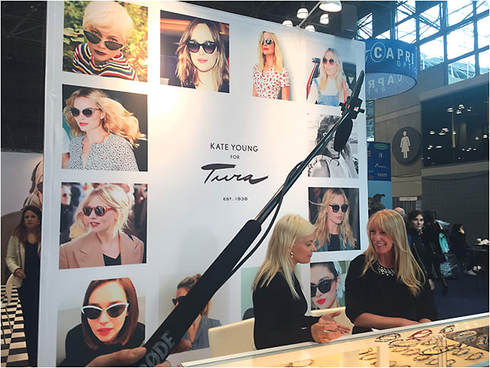 EB's Erinn Morgan, right, talks frame fashion with stylist Kate Young at the Tura booth
